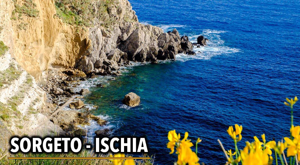 Picturesque cliff view near Thermal Spring of Sorgeto Bay, Ischia Island, Italy.